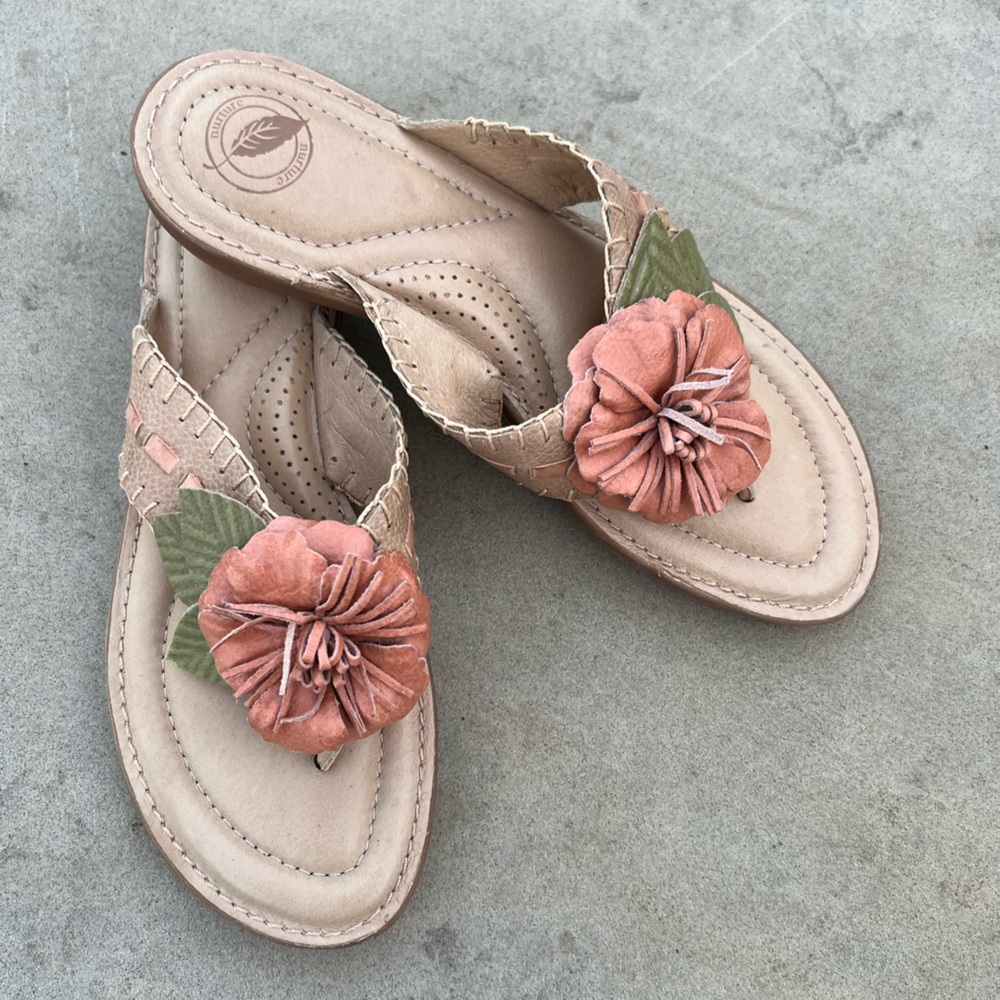 Nurture sandals in light tan leather. Flower accent. Size 9M